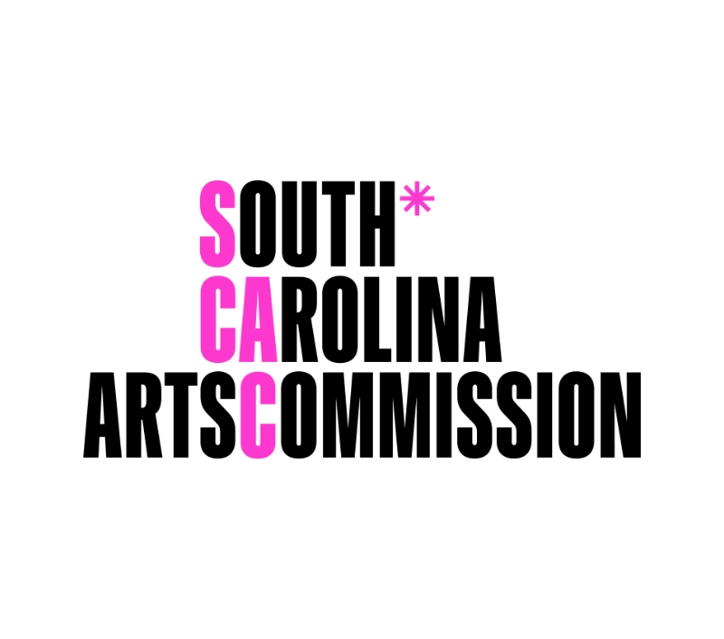 Logo of the South Carolina Arts Commission featuring the acronym SCAC. The bold pink letters "SCAC" are vertically stacked, intersecting the words "South Carolina Arts Commission" in black on a white background. Emphasizing arts-integrated learning, a pink asterisk follows "South.